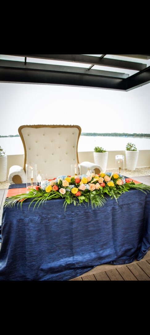 A table with flowers and candles on it
