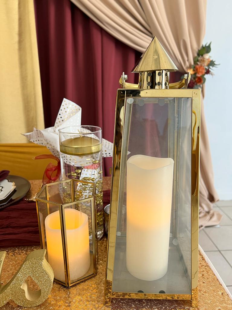 A candle and two candles are on the table.