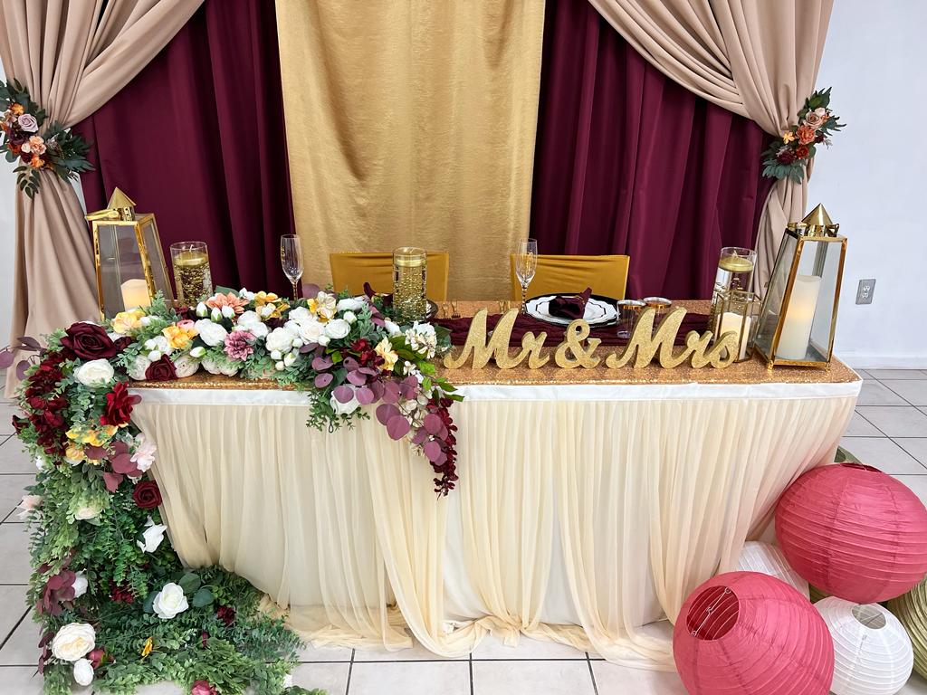 A couple of tables with flowers on top