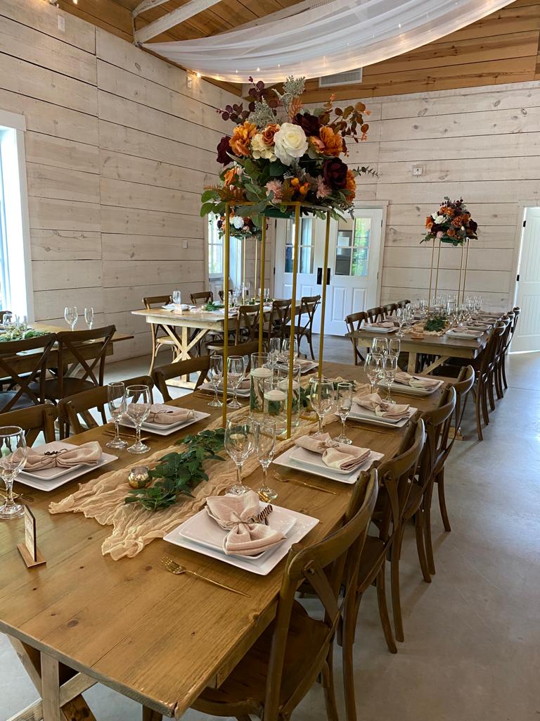 A long table with many plates and glasses on it