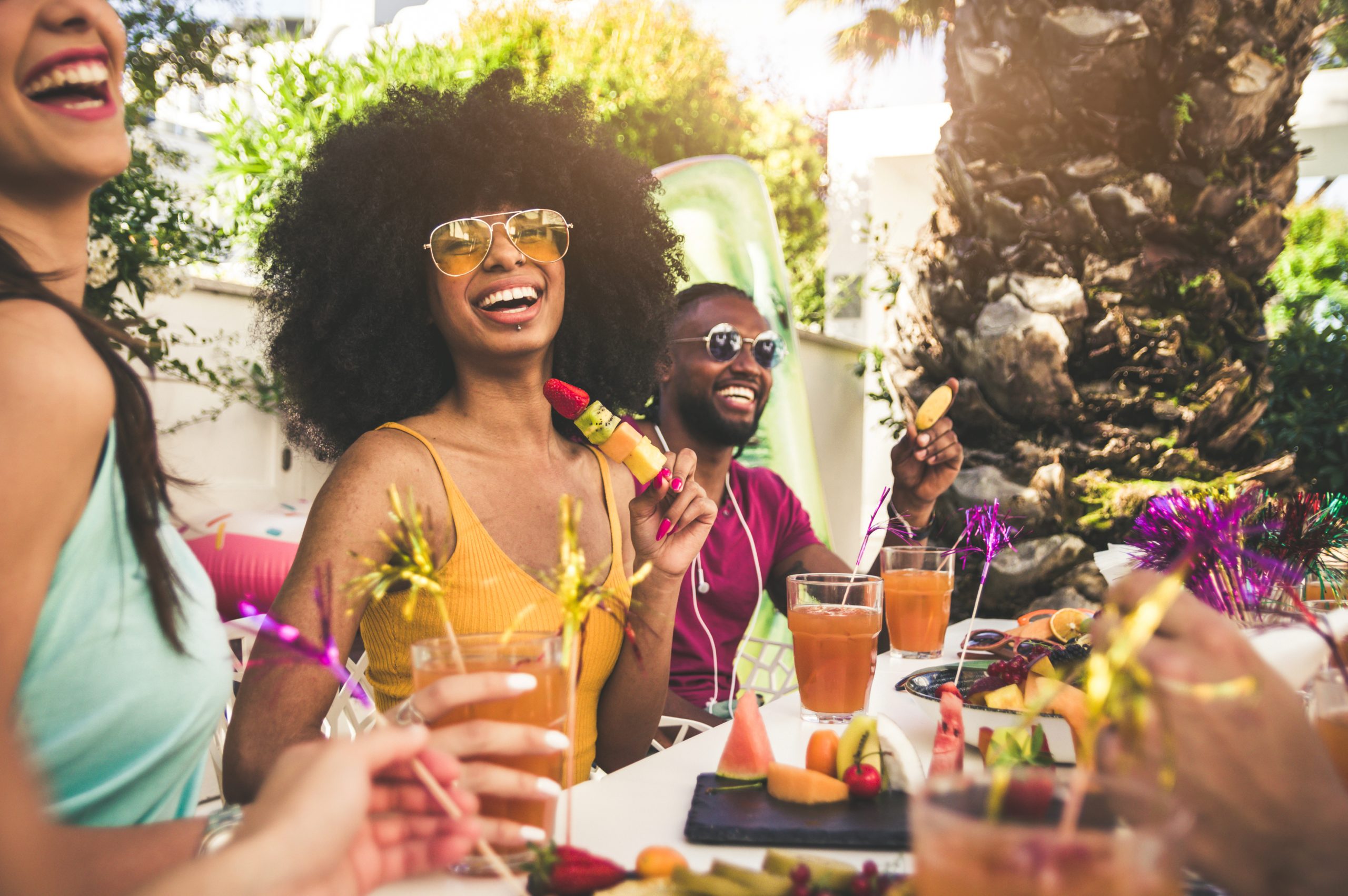 A group of people sitting at a table with drinks.