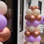 A bunch of balloons that are in the air