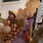 A bunch of balloons that are in the air