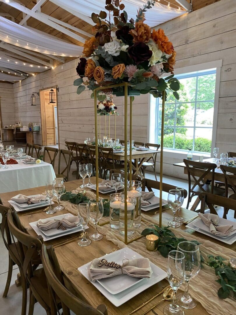 Elegant wedding reception table with floral centerpiece.